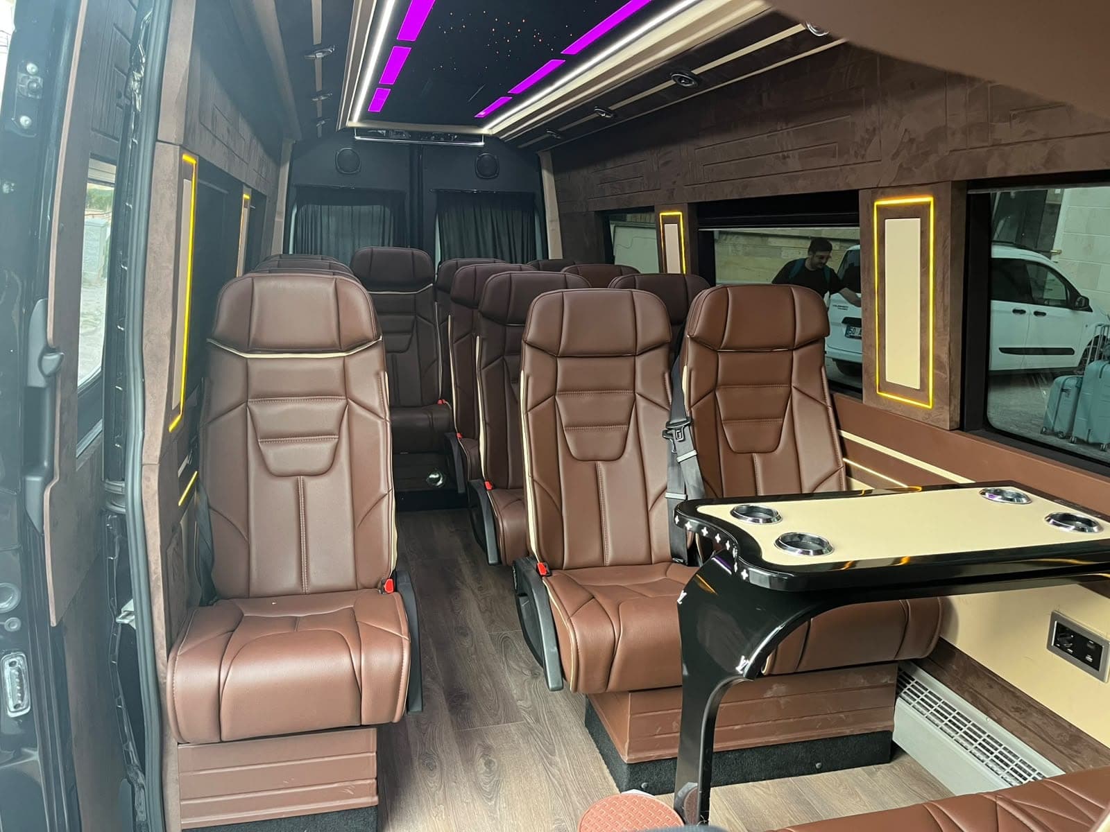 Leather seats and a table in our VIP minibus